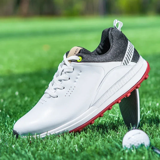 Detail view of a Suubtik GripTech Golf Strider shoe with a golf ball on green grass