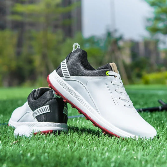 Suubtik GripTech Golf Striders in white positioned on green grass